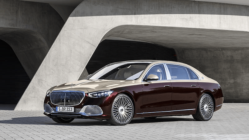 Professional chauffeur at airport with luxury vehicle